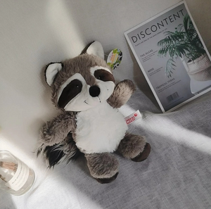 Raccoon hugging stuffed clearance animal